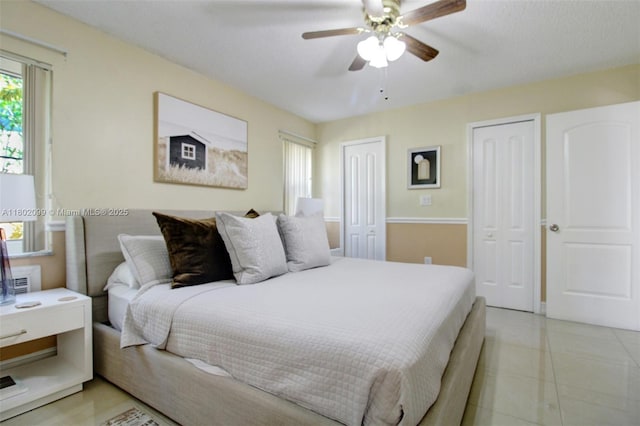 7891 SW 9th Ter, Miami, FL 33144 - bedroom featuring two closets, ceiling fan, and light tile patterned floors