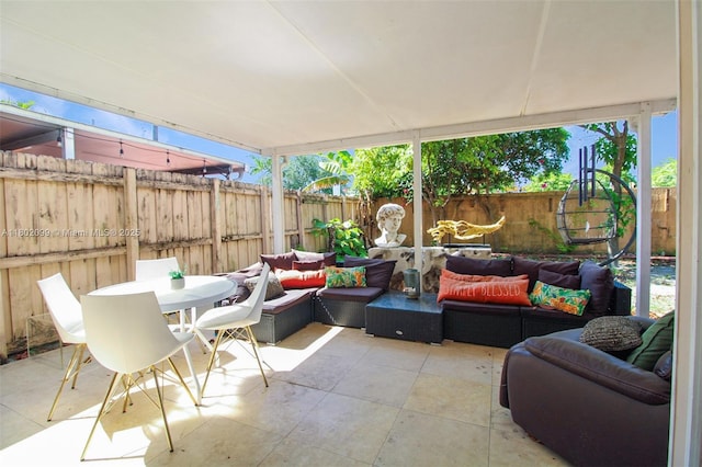 7891 SW 9th Ter, Miami, FL 33144 - fenced backyard with an outdoor hangout area, a patio area, and outdoor dining space
