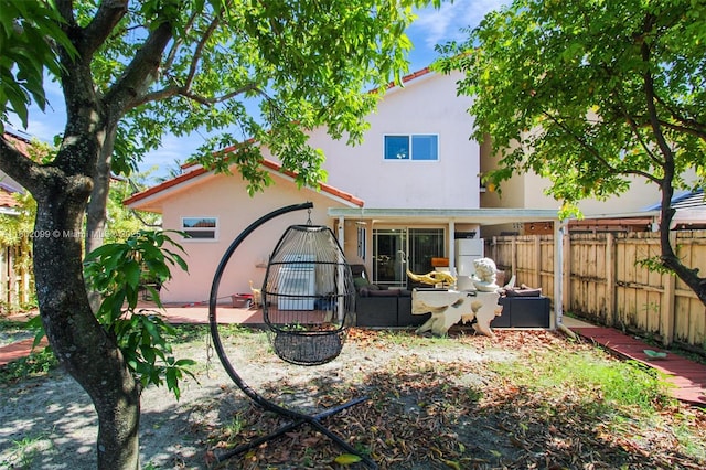 7891 SW 9th Ter, Miami, FL 33144 - back of property featuring stucco siding and a patio