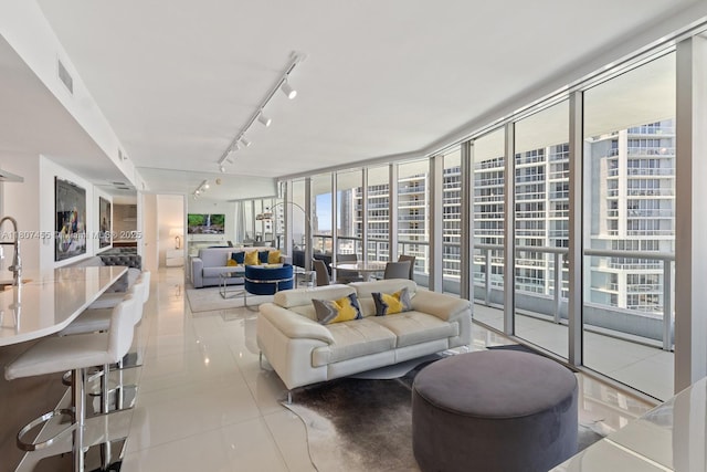495 Brickell Ave Unit 2304, Miami, FL 33131 - living area featuring rail lighting, tile patterned flooring, and expansive windows