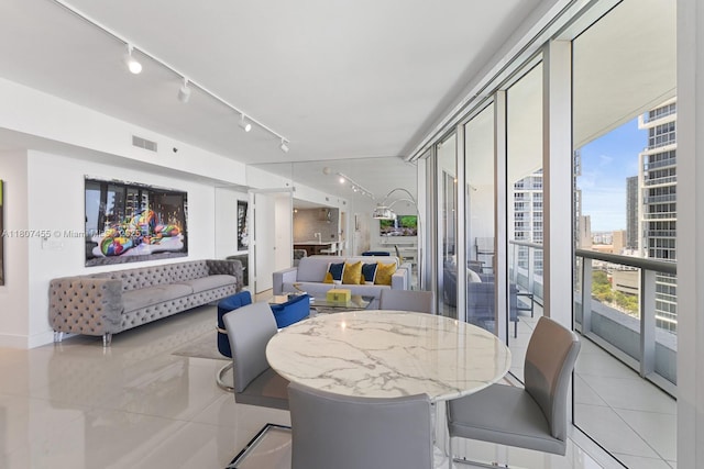 495 Brickell Ave Unit 2304, Miami, FL 33131 - dining area with light tile patterned floors, track lighting, and a view of city