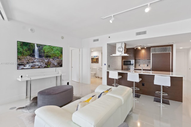 495 Brickell Ave Unit 2304, Miami, FL 33131 - living room with track lighting and light tile patterned floors