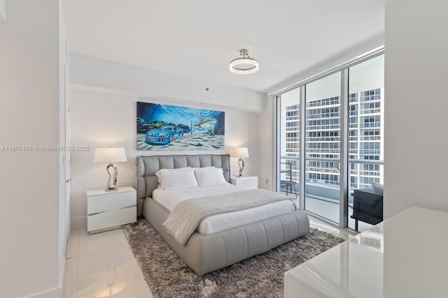 495 Brickell Ave Unit 2304, Miami, FL 33131 - bedroom with expansive windows, access to outside, and baseboards