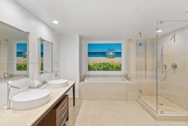 495 Brickell Ave Unit 2304, Miami, FL 33131 - full bathroom featuring a bath, double vanity, a shower stall, tile patterned floors, and recessed lighting