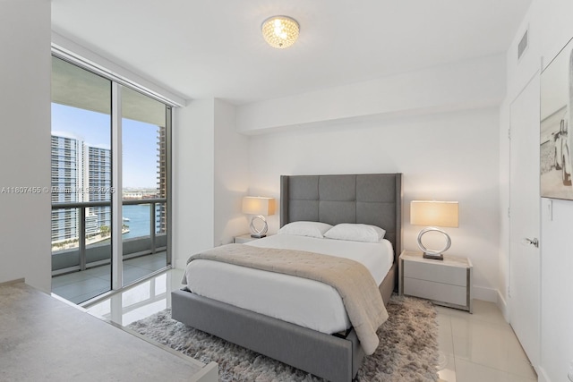 495 Brickell Ave Unit 2304, Miami, FL 33131 - bedroom featuring tile patterned flooring and access to exterior