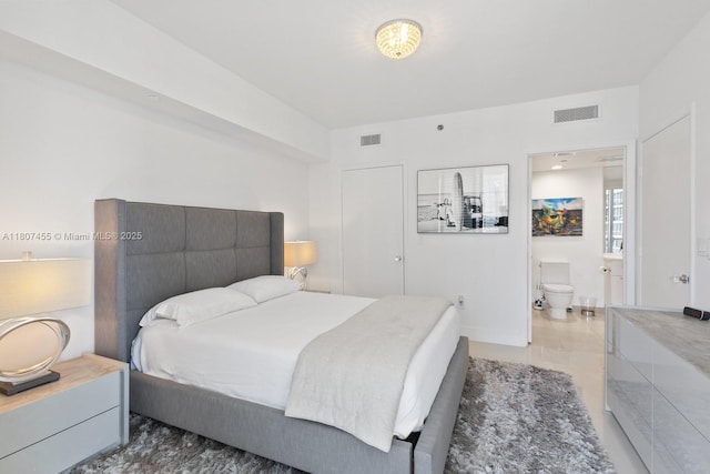 495 Brickell Ave Unit 2304, Miami, FL 33131 - bedroom with connected bathroom