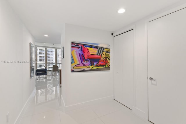 495 Brickell Ave Unit 2304, Miami, FL 33131 - corridor with recessed lighting, tile patterned flooring, and baseboards