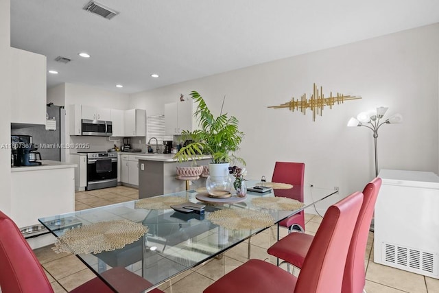 15490 SW 18th Ln, Miami, FL 33185 - dining area with light tile patterned flooring and recessed lighting