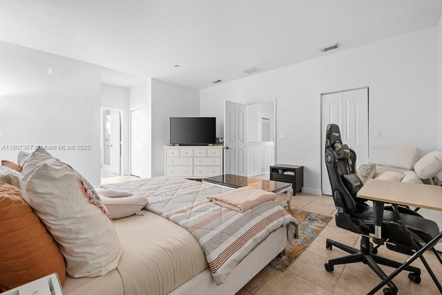 15490 SW 18th Ln, Miami, FL 33185 - bedroom featuring light tile patterned floors, a closet, and an office area