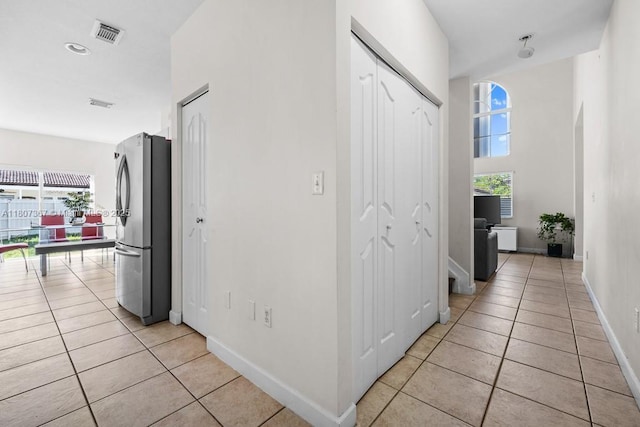 15490 SW 18th Ln, Miami, FL 33185 - corridor featuring light tile patterned floors and baseboards