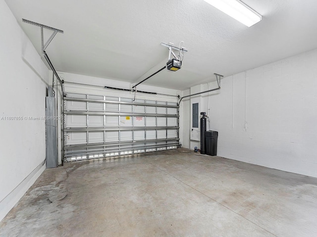 501 NE 6th Ct, Florida City, FL 33034 - garage with a garage door opener and electric panel