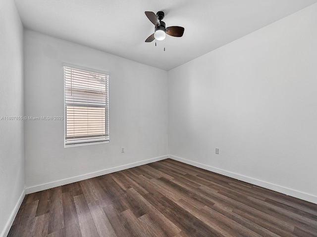 501 NE 6th Ct, Florida City, FL 33034 - empty room featuring dark wood-style flooring, baseboards, and a ceiling fan