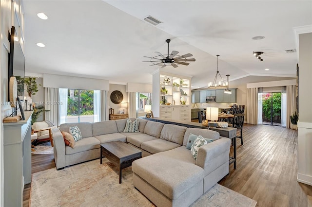 7850 NW 53rd Ct, Lauderhill, FL 33351 - living room featuring vaulted ceiling, plenty of natural light, ceiling fan, light wood-style flooring, and recessed lighting