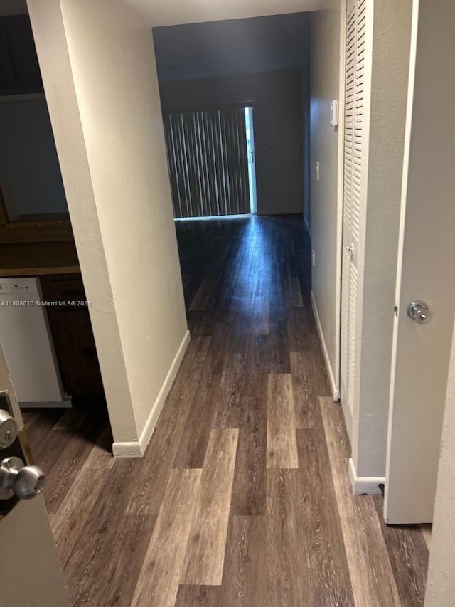16750 NE 10th Ave Unit 225, North Miami Beach, FL 33162 - hall with wood finished floors and baseboards
