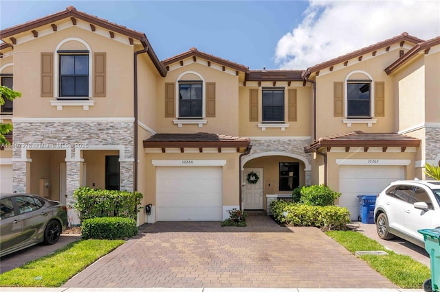 10260 SW 228th Ter Unit 10260, Miami, FL 33190 - multi unit property with an attached garage, decorative driveway, stucco siding, and a tile roof