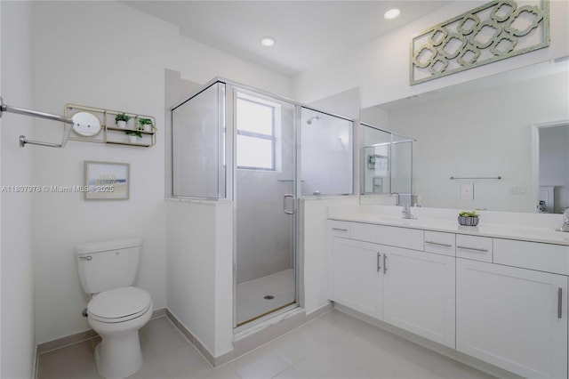 10260 SW 228th Ter Unit 10260, Miami, FL 33190 - full bath featuring double vanity, a shower stall, toilet, baseboards, and tile patterned floors