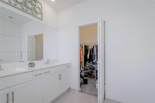 10260 SW 228th Ter Unit 10260, Miami, FL 33190 - bathroom featuring double vanity, tile patterned floors, baseboards, and a spacious closet