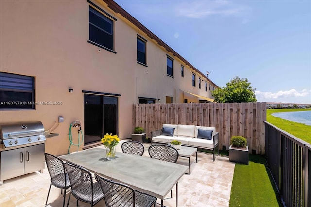 10260 SW 228th Ter Unit 10260, Miami, FL 33190 - fenced backyard featuring a patio area, a grill, outdoor lounge area, and a water view
