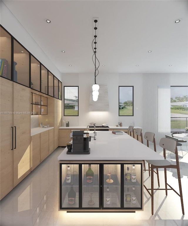 8275 SW 93rd St, Miami, FL 33156 - kitchen featuring healthy amount of natural light, a center island with sink, light countertops, recessed lighting, and glass insert cabinets