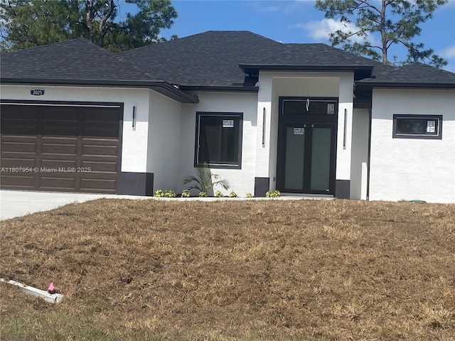 3806 E 18th St, Lehigh Acres, FL 33972 - view of front of property with stucco siding, a garage, roof with shingles, and a front lawn