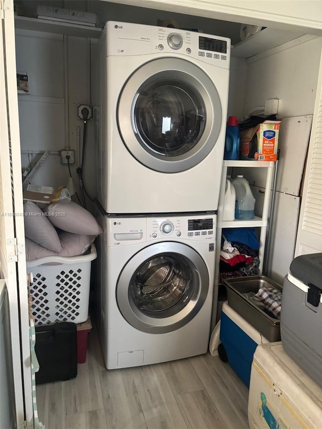 2427 Garland Cir Unit 195, Hollywood, FL 33021 - laundry area featuring stacked washer / drying machine and wood finished floors