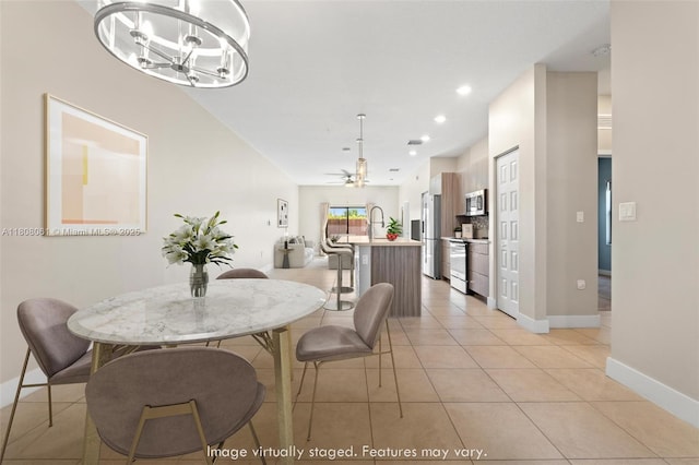 7825 NW 104th Ave Unit 4, Doral, FL 33178 - dining area featuring a chandelier, baseboards, recessed lighting, light tile patterned floors, and ceiling fan