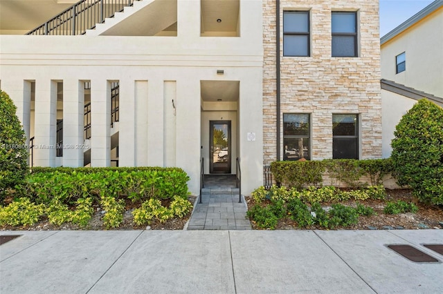 7825 NW 104th Ave Unit 4, Doral, FL 33178 - property entrance featuring stone siding