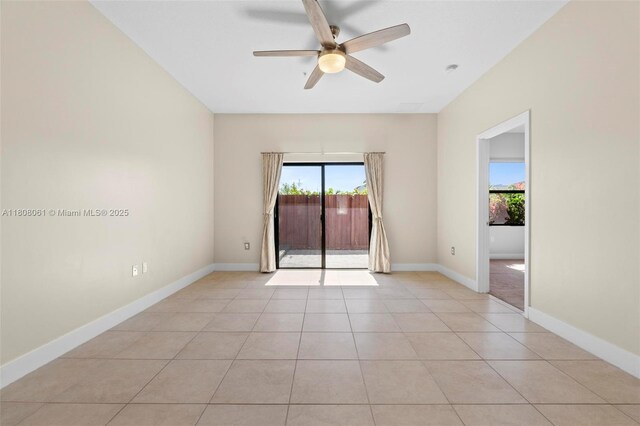 7825 NW 104th Ave Unit 4, Doral, FL 33178 - spare room with a ceiling fan, light tile patterned flooring, and baseboards