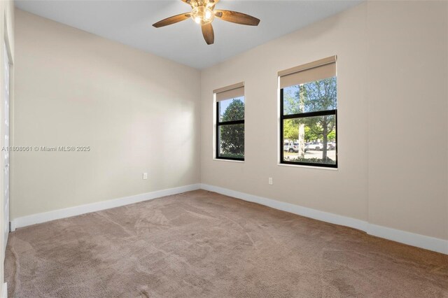 7825 NW 104th Ave Unit 4, Doral, FL 33178 - spare room with carpet flooring, a ceiling fan, and baseboards
