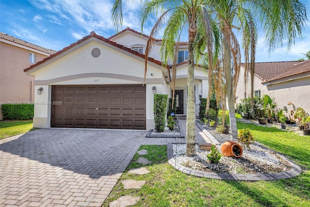 1317 Majesty Ter, Weston, FL 33327 - mediterranean / spanish house featuring stucco siding, decorative driveway, a garage, and a front yard