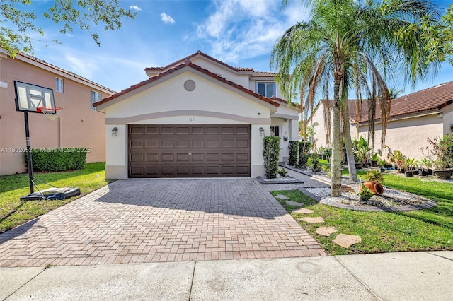 1317 Majesty Ter, Weston, FL 33327 - mediterranean / spanish-style house featuring decorative driveway, stucco siding, an attached garage, and a tiled roof