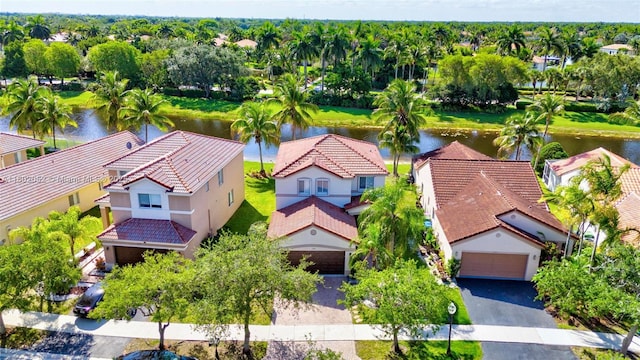 1317 Majesty Ter, Weston, FL 33327 - aerial perspective of suburban area featuring a nearby body of water and a tree filled landscape