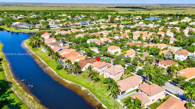 1317 Majesty Ter, Weston, FL 33327 - aerial perspective of suburban area with a nearby body of water