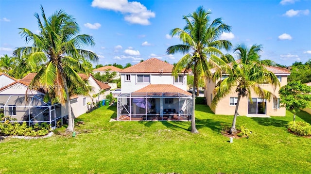 1317 Majesty Ter, Weston, FL 33327 - rear view of property featuring stucco siding, a lawn, glass enclosure, and a tile roof