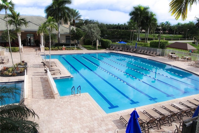 1317 Majesty Ter, Weston, FL 33327 - community pool with a patio