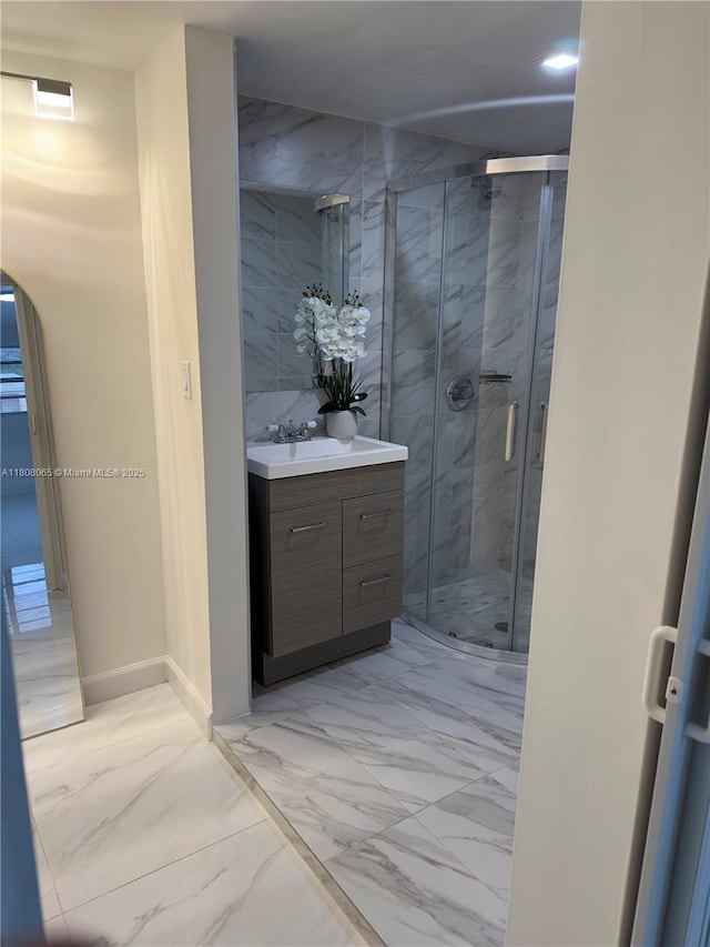 650 E 55th St, Hialeah, FL 33013 - full bath featuring marble finish flooring, vanity, and a marble finish shower