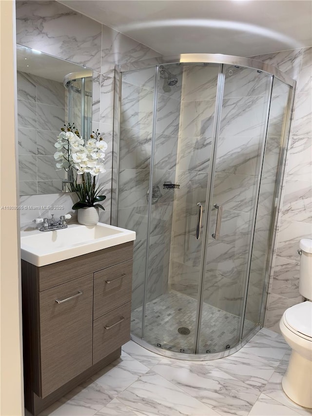 650 E 55th St, Hialeah, FL 33013 - full bath with marble finish floors, vanity, a shower stall, and tile walls
