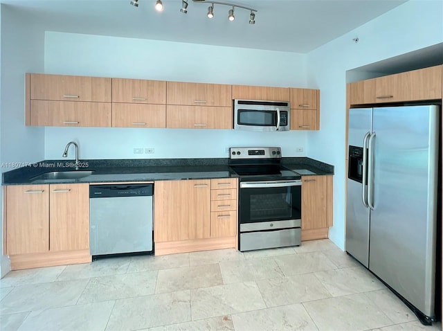 350 S Miami Ave Unit 3013, Miami, FL 33130 - kitchen featuring stainless steel appliances, dark countertops, light brown cabinetry, and modern cabinets