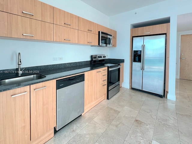 350 S Miami Ave Unit 3013, Miami, FL 33130 - kitchen with appliances with stainless steel finishes, light brown cabinets, modern cabinets, and dark stone countertops