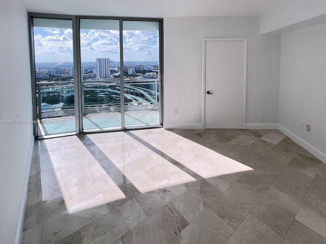 350 S Miami Ave Unit 3013, Miami, FL 33130 - spare room featuring floor to ceiling windows, healthy amount of natural light, and a view of city