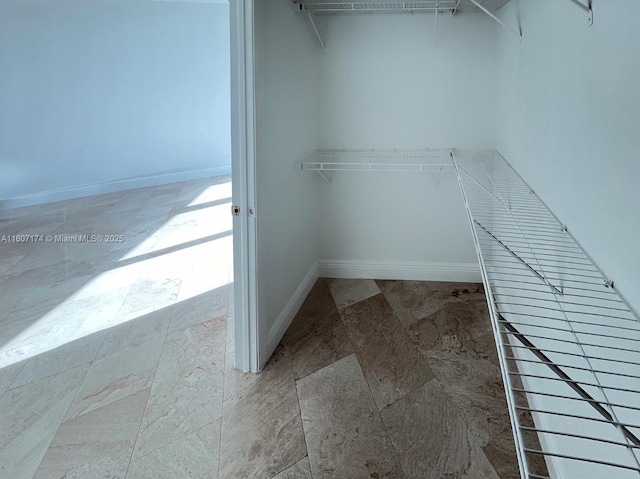 350 S Miami Ave Unit 3013, Miami, FL 33130 - walk in closet featuring stone finish floors