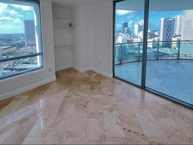 350 S Miami Ave Unit 3013, Miami, FL 33130 - unfurnished room with a view of city and baseboards