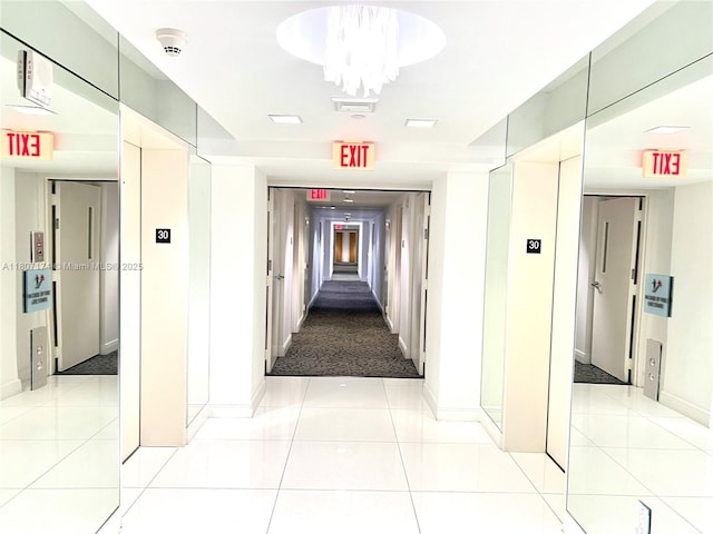 350 S Miami Ave Unit 3013, Miami, FL 33130 - hall featuring elevator and light tile patterned floors