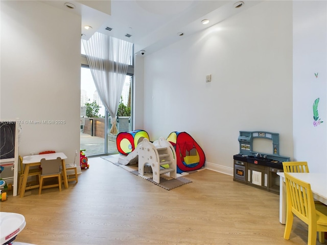 350 S Miami Ave Unit 3013, Miami, FL 33130 - playroom featuring wood finished floors and baseboards