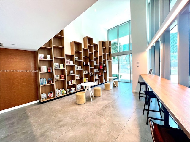 350 S Miami Ave Unit 3013, Miami, FL 33130 - sitting room with a high ceiling and concrete floors
