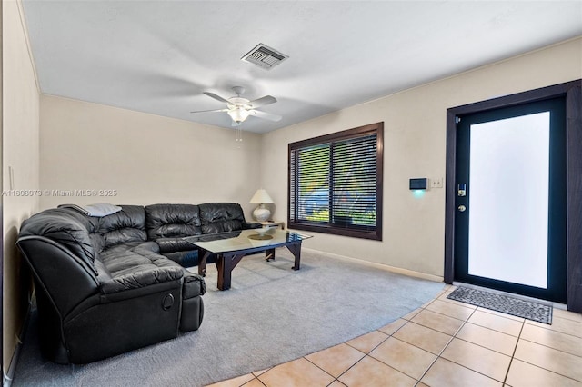 9155 SW 179th St, Palmetto Bay, FL 33157 - living room with light colored carpet, light tile patterned flooring, a ceiling fan, and baseboards