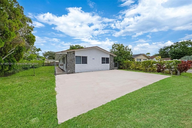 6121 SW 40th Ct, Miramar, FL 33023 - rear view of house featuring stone siding, stucco siding, and a patio