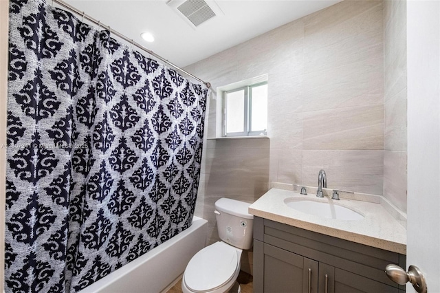 6121 SW 40th Ct, Miramar, FL 33023 - bathroom featuring tile walls, toilet, shower / bath combo with shower curtain, and vanity