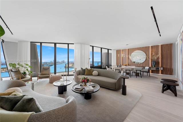 1000 Biscayne Blvd Unit 3201, Miami, FL 33132 - living area featuring a wall of windows, a water view, and light wood finished floors