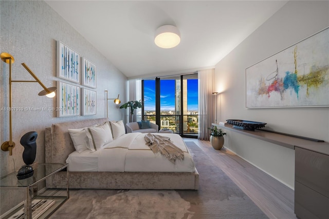 1000 Biscayne Blvd Unit 3201, Miami, FL 33132 - bedroom with floor to ceiling windows, wood finished floors, and baseboards